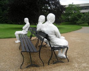 Three People On Four Benches